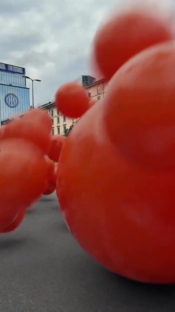 Inter Orange Balls Rolling in the Streets of Milan