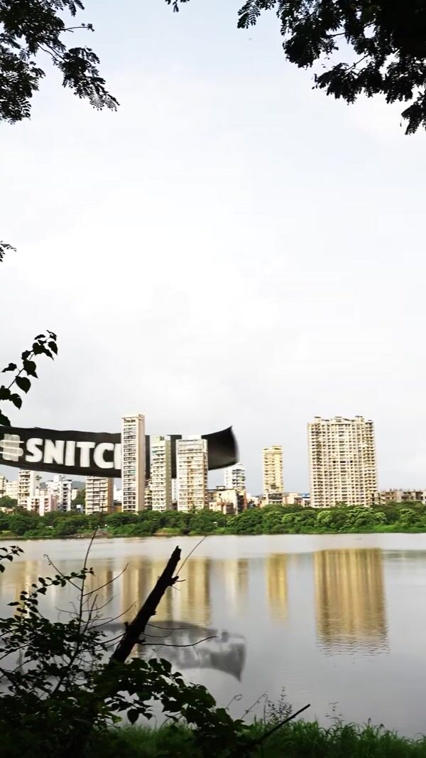 Snitch Black Banner Flying Through City