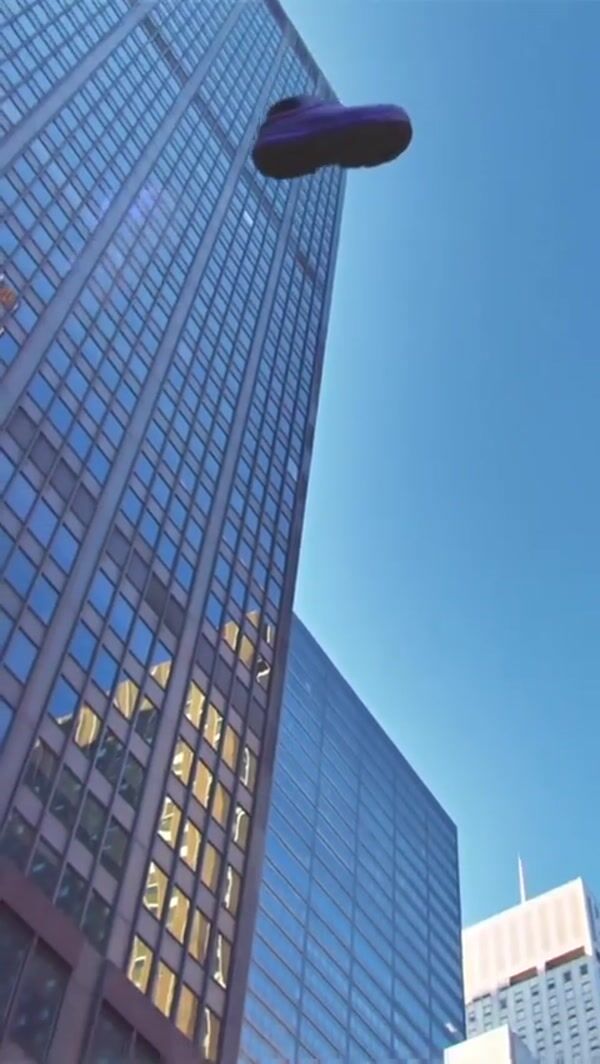 UGG Purple Slipper Falling From the Sky in NYC