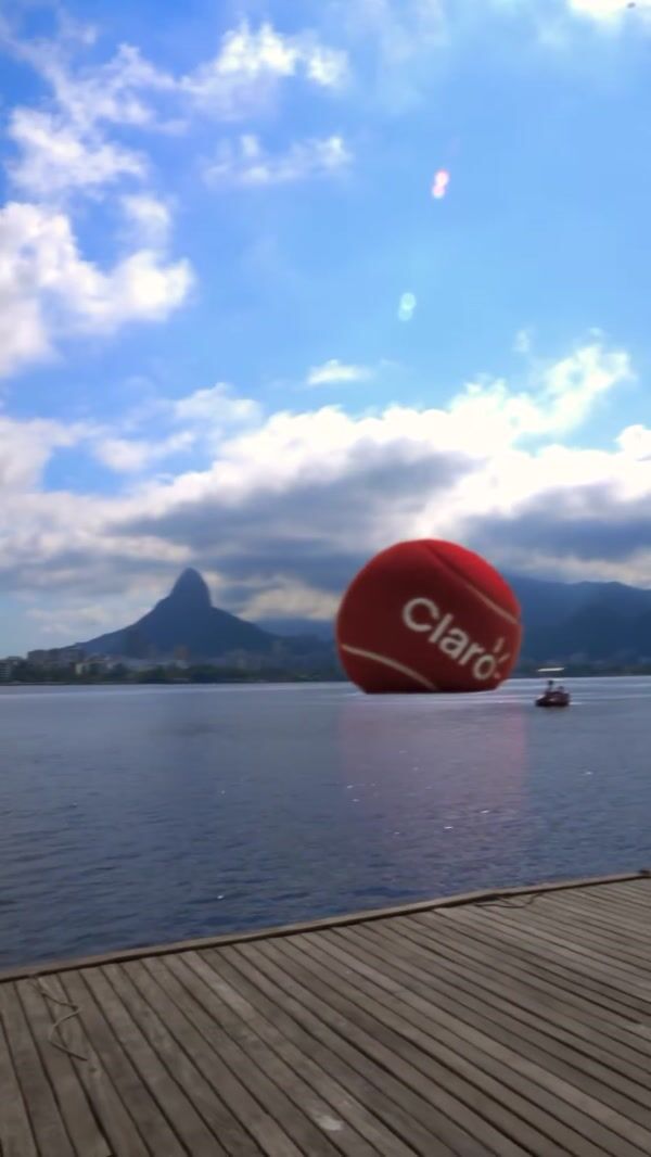 Claro Red Tennis Ball Rolls on the Lake