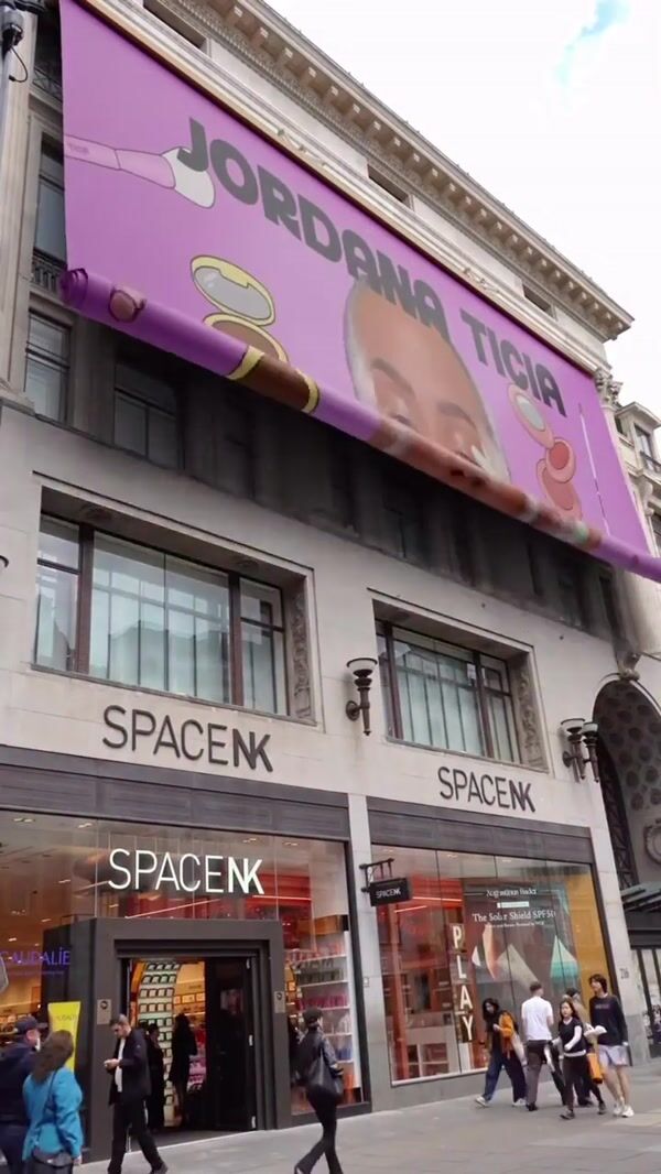 Jordana Ticia Giant Banner Unrolls on Facade