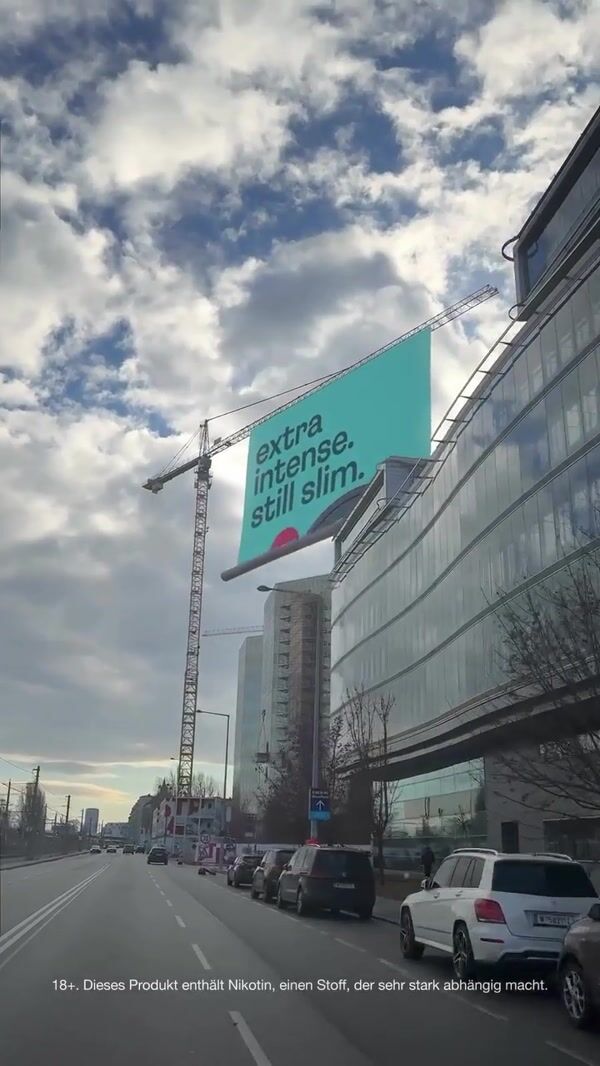 Skruf Poster Rolls Down From a Crane
