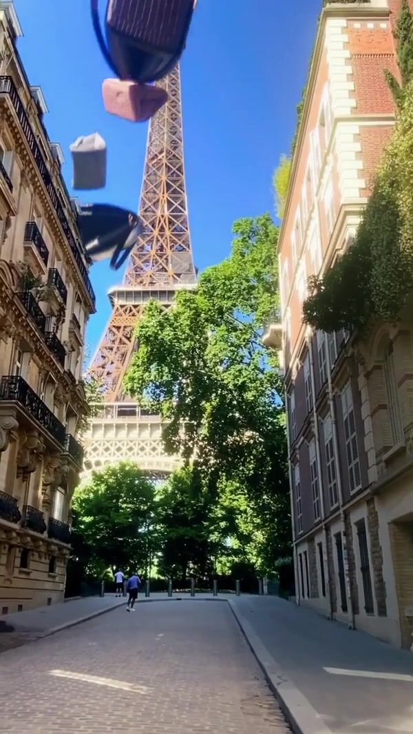 Victoria Beckham Flying Handbags at Eiffel Tower