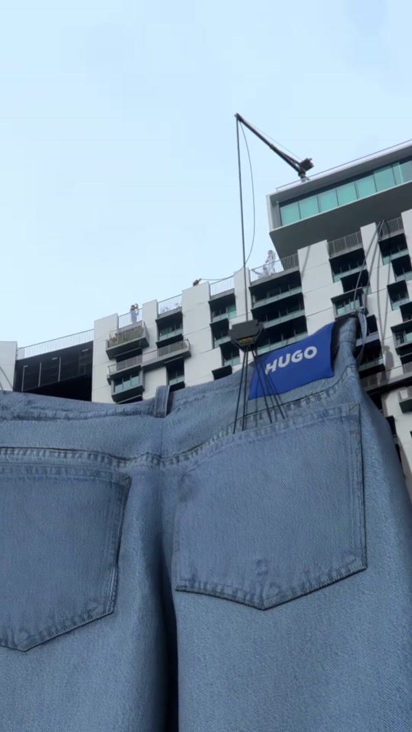 Hugo Jeans Hanging From Building