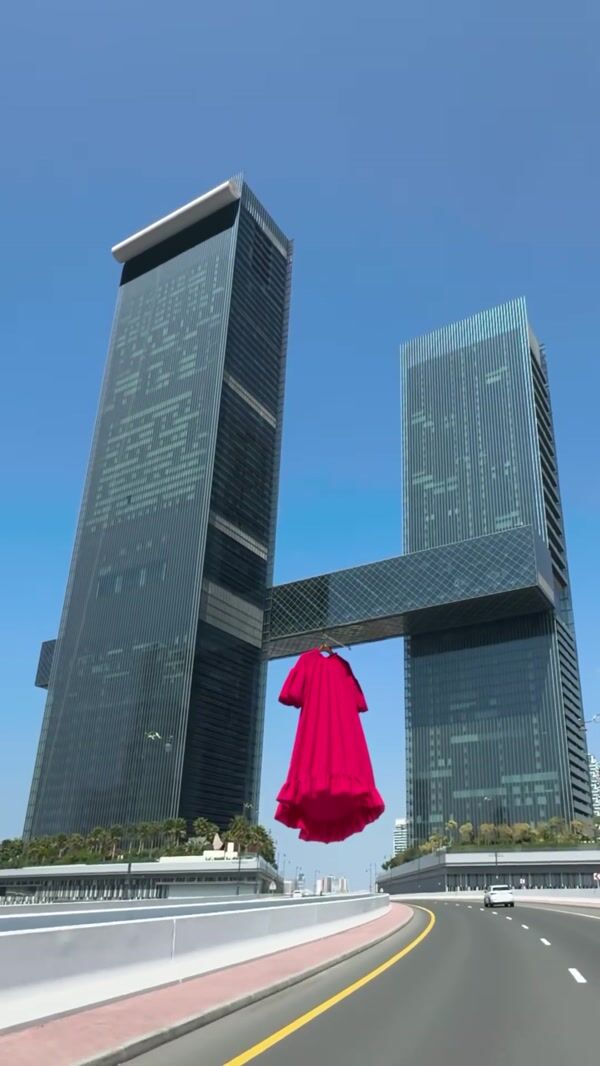 Splash Fashions Giant Red Dress Hangs in Dubai Gate Towers
