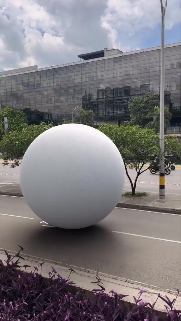 Punto Blanco Giant White Sphere Rolls Across City and Store