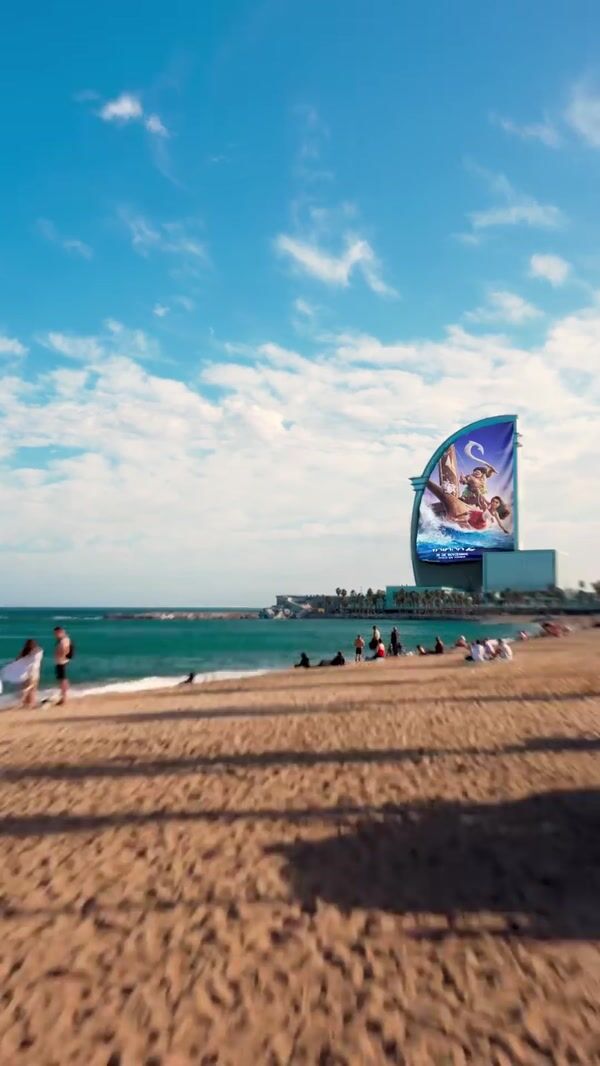 Disney Movie Poster Rolls Down on Building