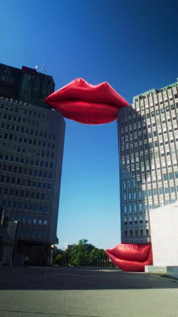 Smile Inflatable Lips Rest Between Buildings