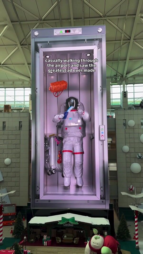 Astronaut Leaps for Flying Ticket in Elevator