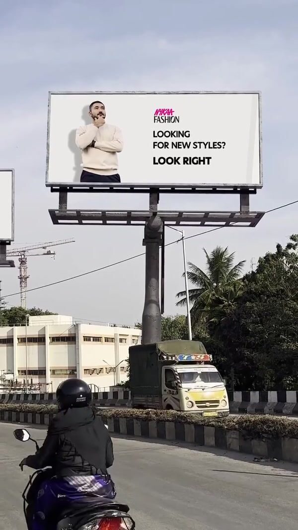 Nykaa Fashion Man Crossing Through Billboards
