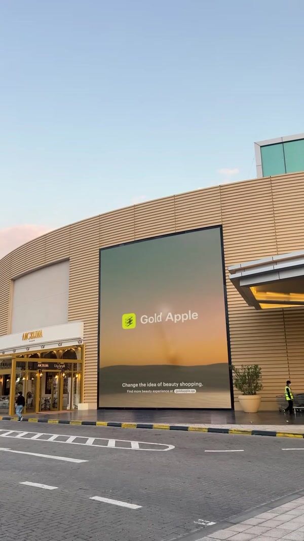 Gold Apple Giant Bags Burst from Billboard
