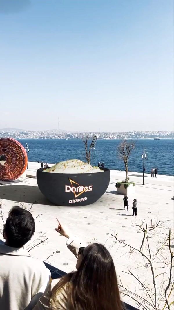 Doritos Chip Dipped In Sauce By Helicopter