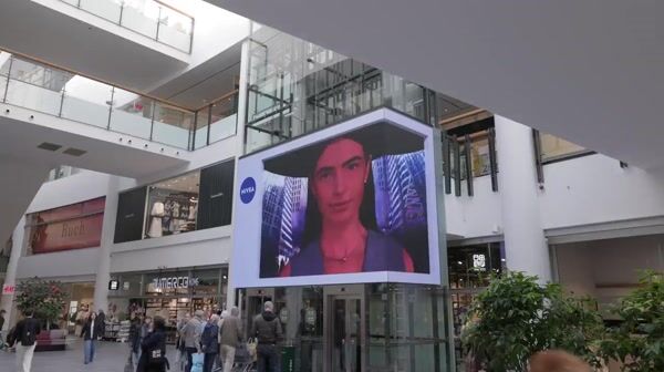 Nivea Robotic Arm Places Bottle Center Screen