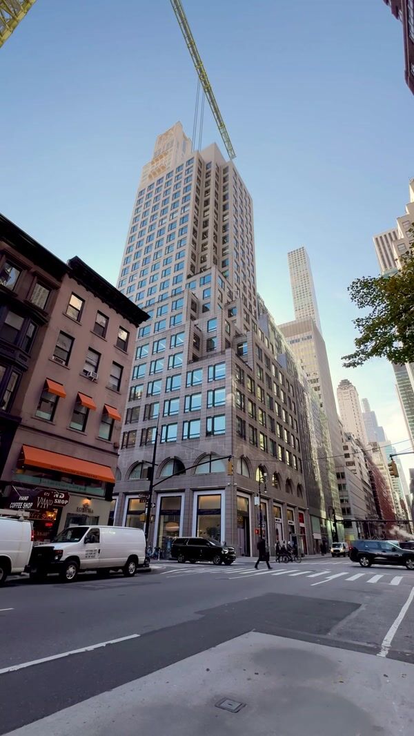 Michael Kors Crane Places Bag on Building