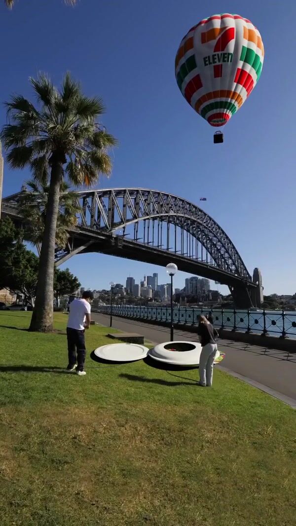 7-Eleven Inflated Cups Take Off Near the Bridge