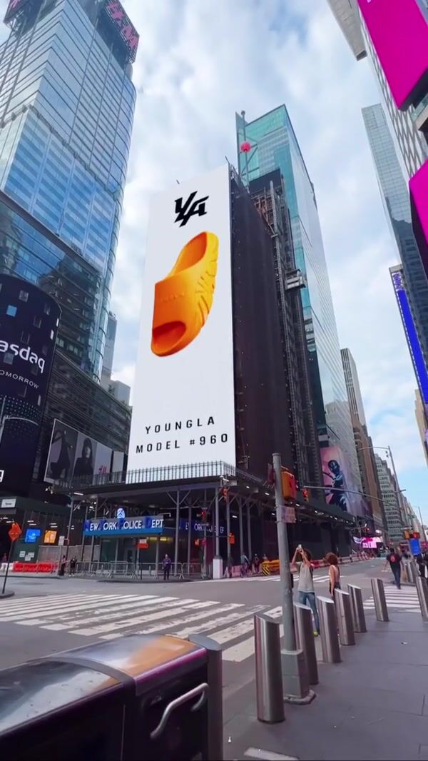 YoungLA Giant Slide Bursts From Times Square Billboard