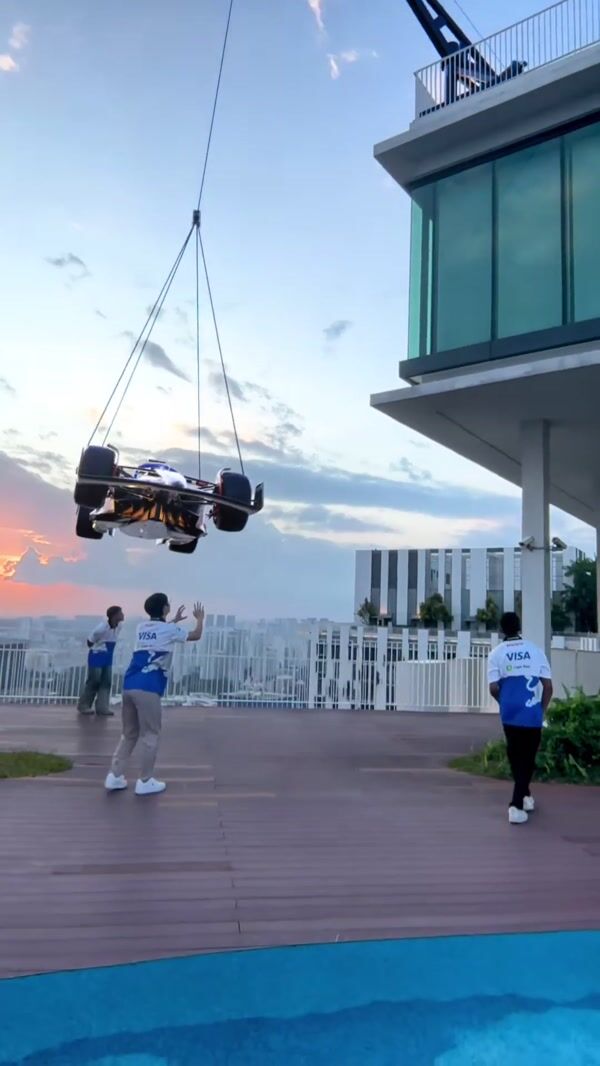 HUGO F1 Car Lifted in High-Rise Building for VISA Cash App