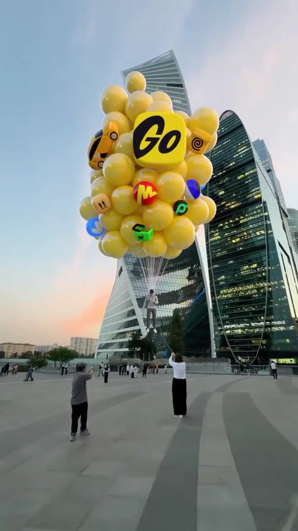 Yandex Go Man Lifted by Yellow Balloons Stunt