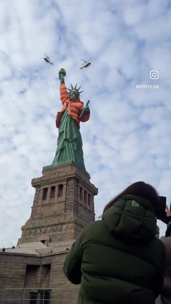 Grubhub Statue of Liberty Wears Orange Jacket