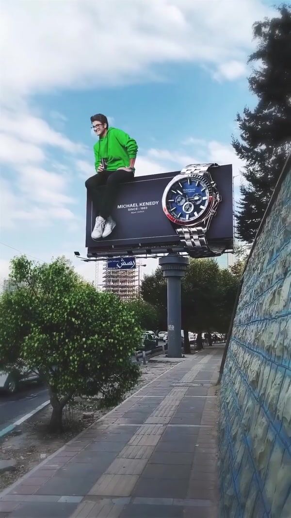 Michael Kennedy Man Poses on Watch Billboard