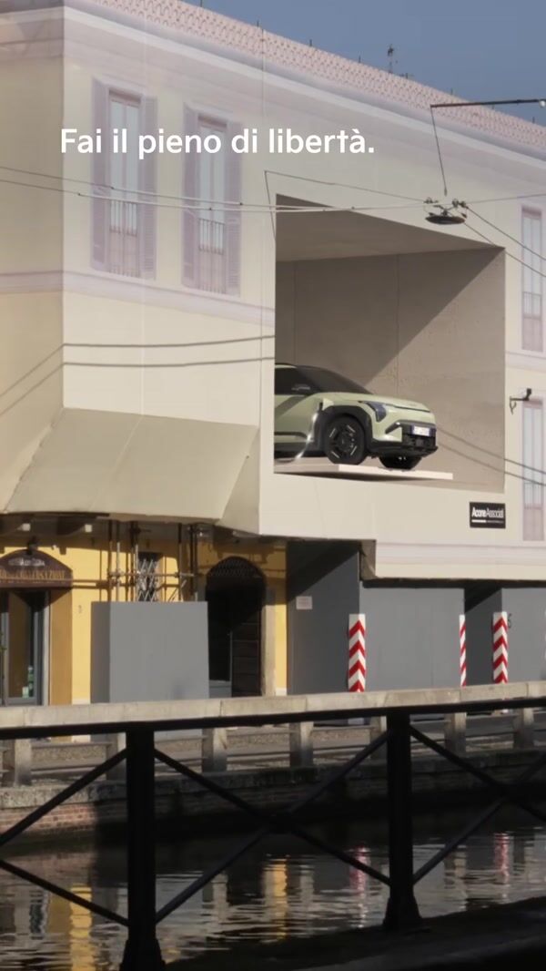 Kia SUV Crossing Canal on Extending Bridge