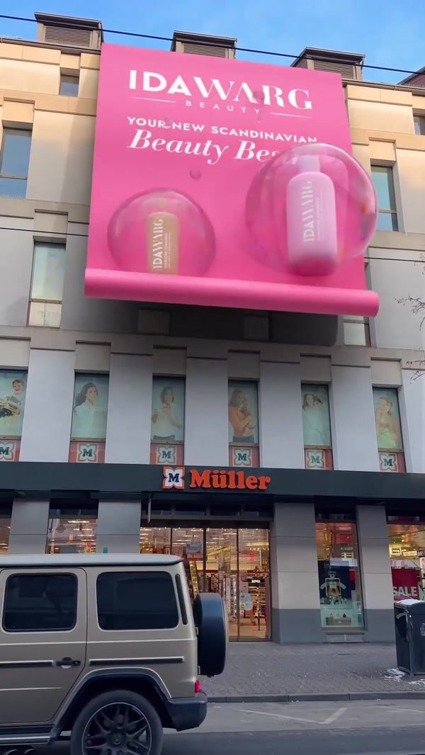IDA WARG Beauty Products Float From Giant Banner