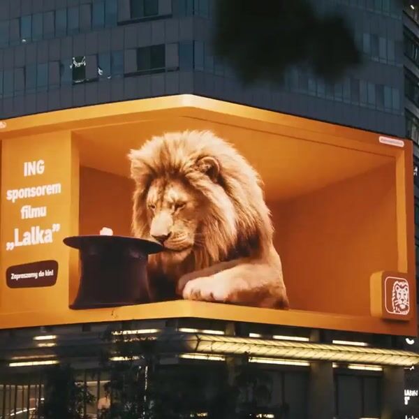 ING Lion Plays with Popcorn at Screen Edge