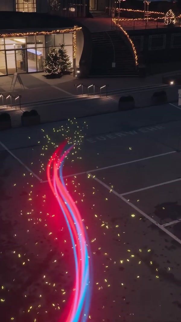 NetCologne Light Trail Approaches Through Flora Köln