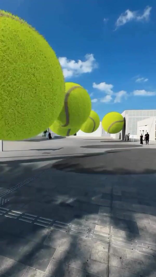 Mubadala Giant Tennis Balls Roll Through Abu Dhabi