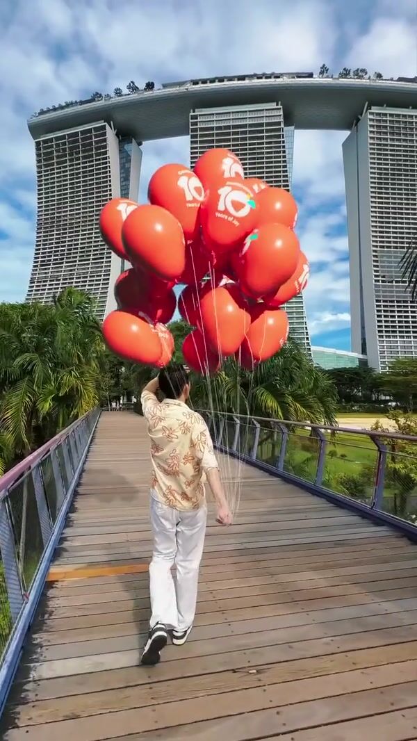 Klook Plane Carries Banner Over Marina Bay Sands
