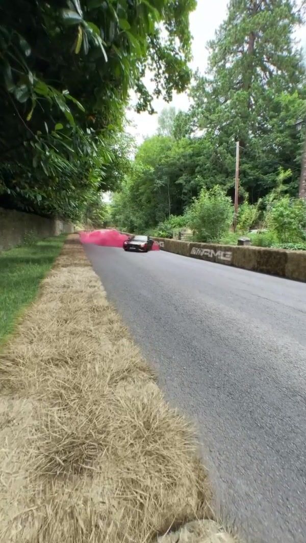 Mercedes-AMG Sports Car Trails Red Smoke