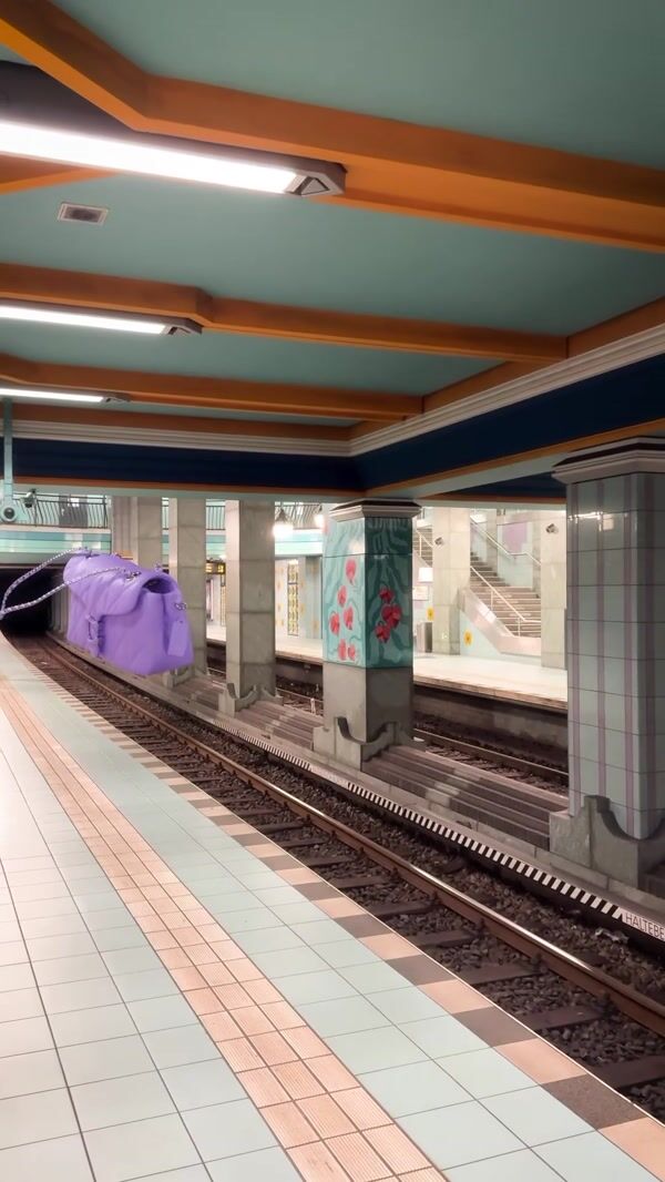 Coach Shoulder Bag Floats Above Railway