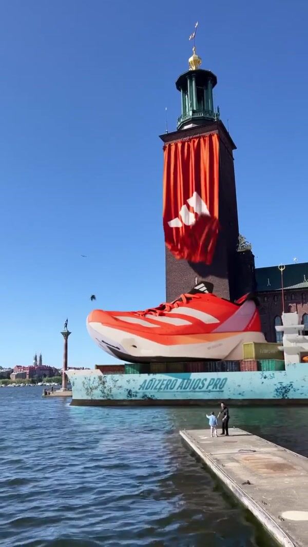 Adidas Giant Orange Shoe Floating In Stockholm
