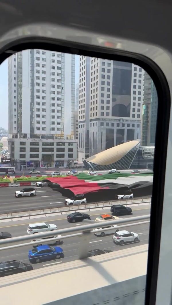 Nissan Cars Pull Giant UAE Flag on Highway