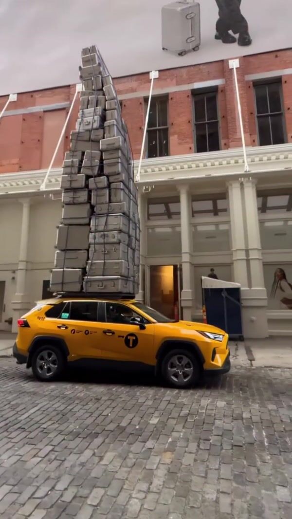 Monos Towering Suitcase on Cab Roof