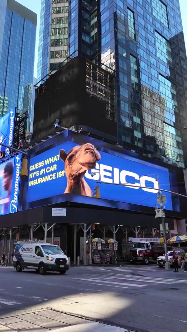 GEICO Camel Peeks Out of Billboard
