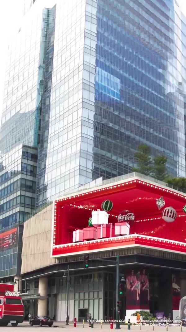 Coca-Cola Truck Collects Gifts From Billboard