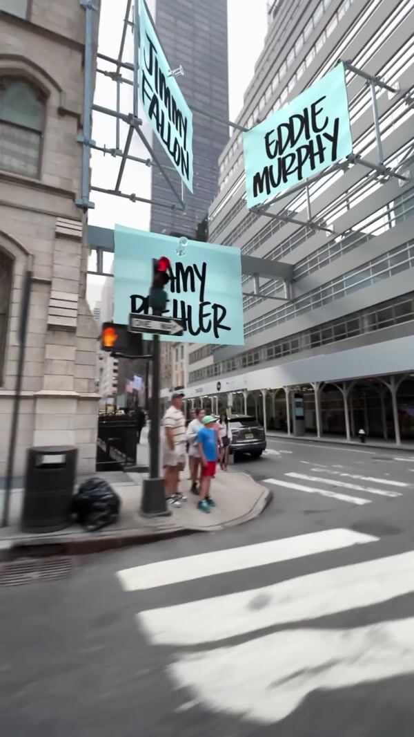 SNL Name Banners Hang on Buildings