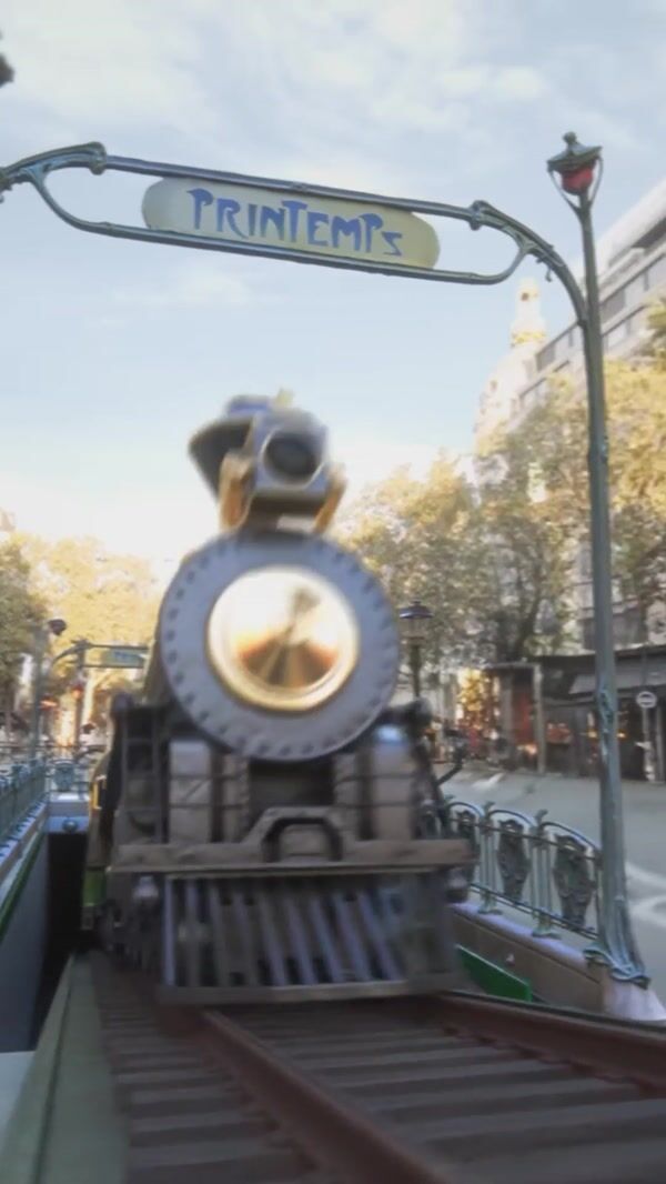 Printemps Steam Train Driving Through Buildings