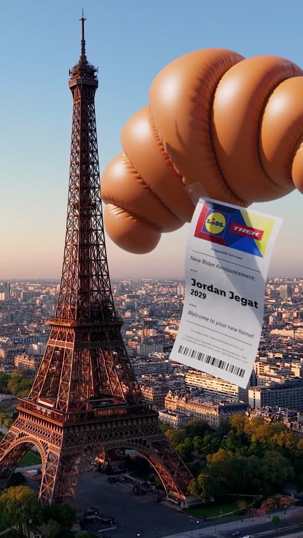 Large croissant floats next to Eiffel Tower in Paris