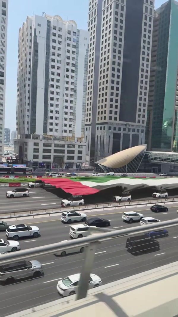 Nissan Convoy Carries Giant UAE Flag