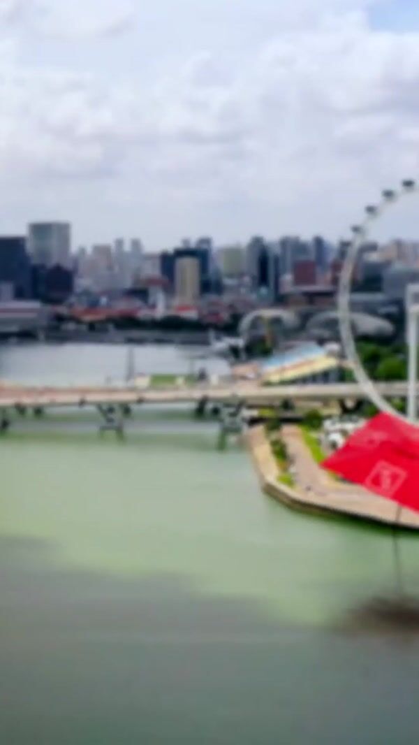 CÉ LA VI Square Umbrella Floats Through Singapore