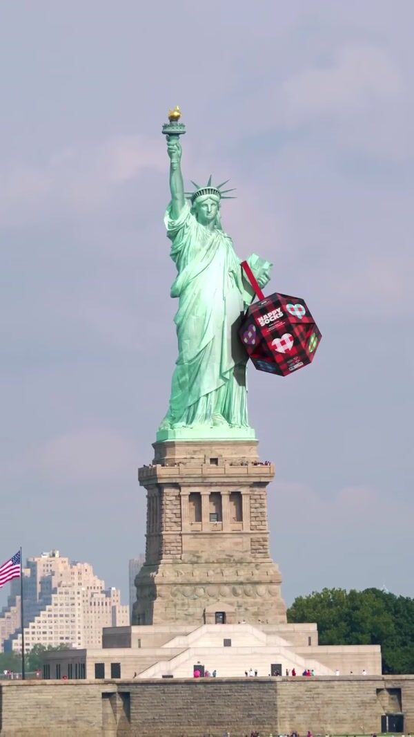 Happy Socks Giant Christmas Balls Fall at Statue of Liberty