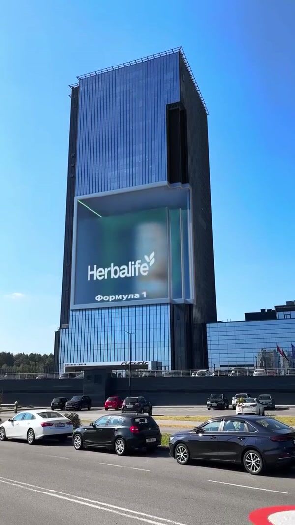 Herbalife TV Giant Jar Emerges From Building