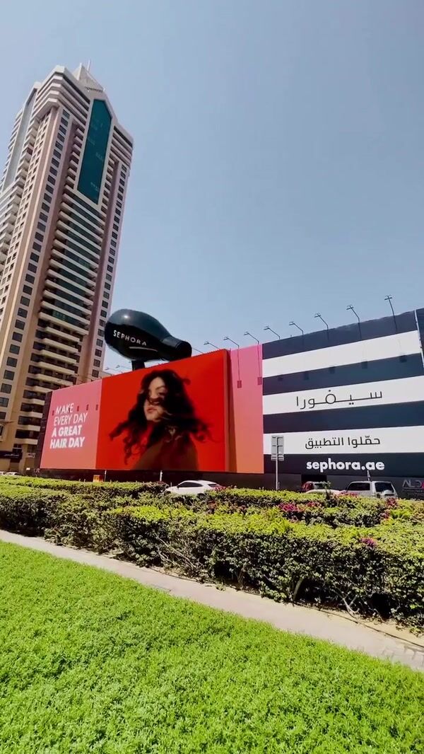 Sephora Hair Dryer Emerges Behind Billboard