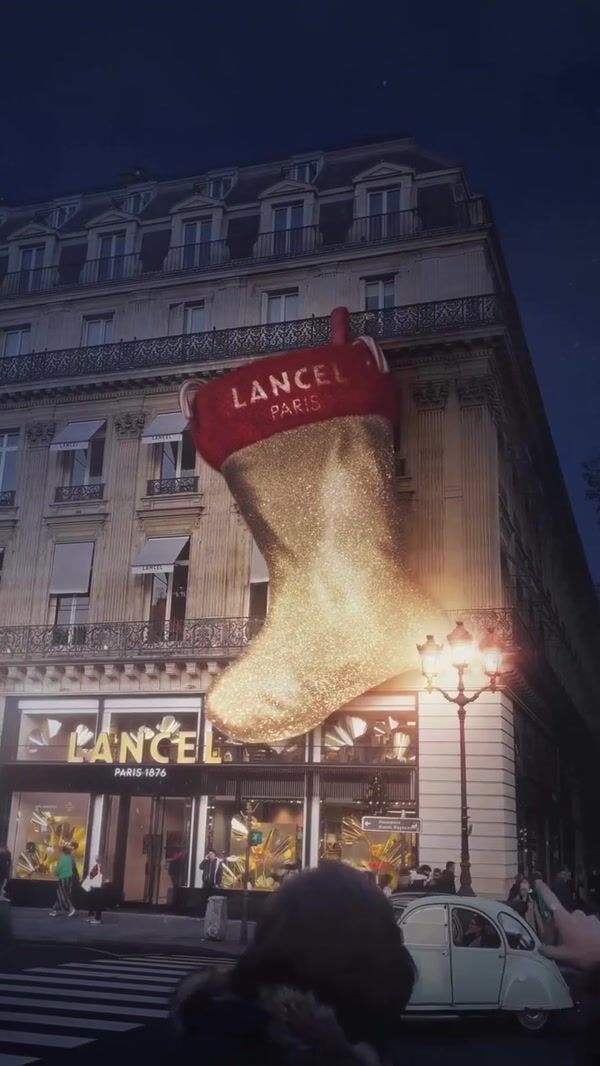 Lancel Santa Puts Bags into Giant Christmas Sock