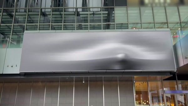 Train Pops Out of Billboard