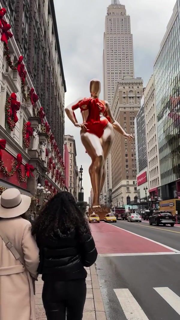 Adore Me Golden Mannequin Pulled by Taxis
