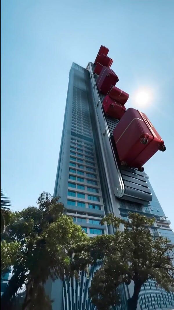 Samsonite Red Luggage on Skyscraper Conveyor Belt