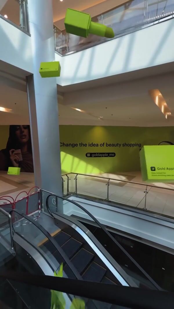 Gold Apple Beauty Products Floats at Shopping Mall